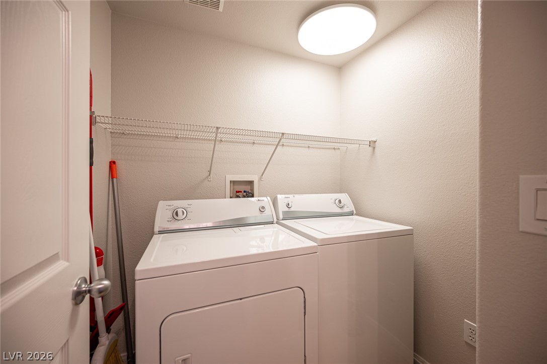 7701 West Robindale Road, Unit 274 Las Vegas, NV 89113 - Photo 35 of 38 This dedicated laundry area offers practical convenience for daily chores.
