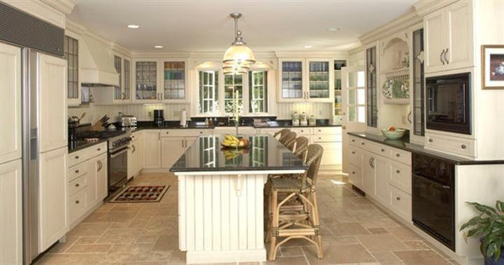 265 Seapuit Road Osterville, MA 02655 - Photo 15 of 30 a kitchen with a sink stove and cabinets