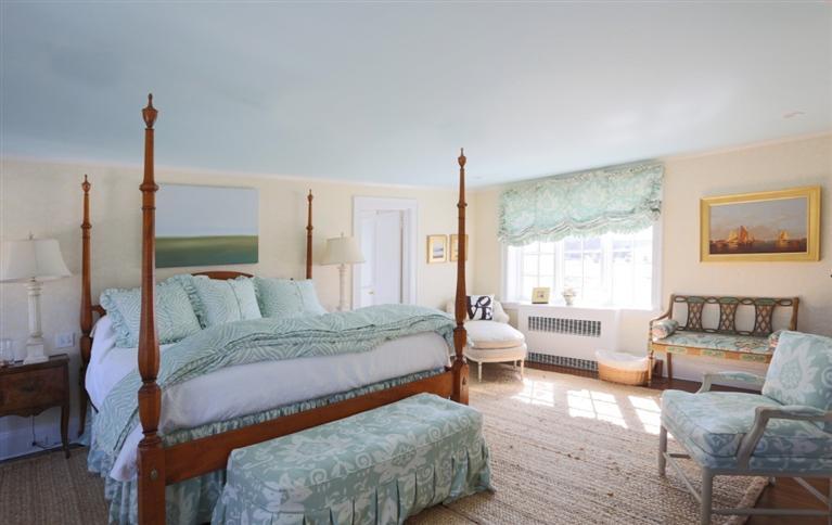265 Seapuit Road Osterville, MA 02655 - Photo 17 of 30 a spacious bedroom with a bed and wooden floor