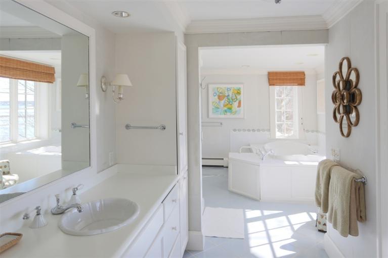 265 Seapuit Road Osterville, MA 02655 - Photo 20 of 30 a bathroom with a tub sink and mirror