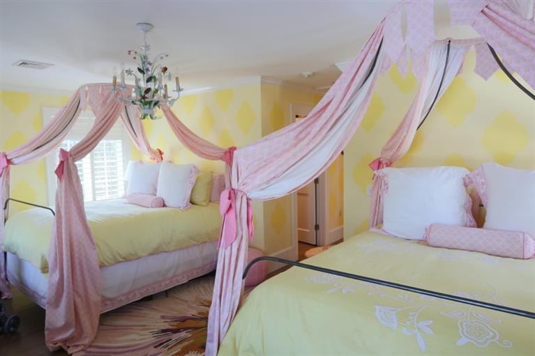 265 Seapuit Road Osterville, MA 02655 - Photo 22 of 30 a bedroom with a bed and a chandelier