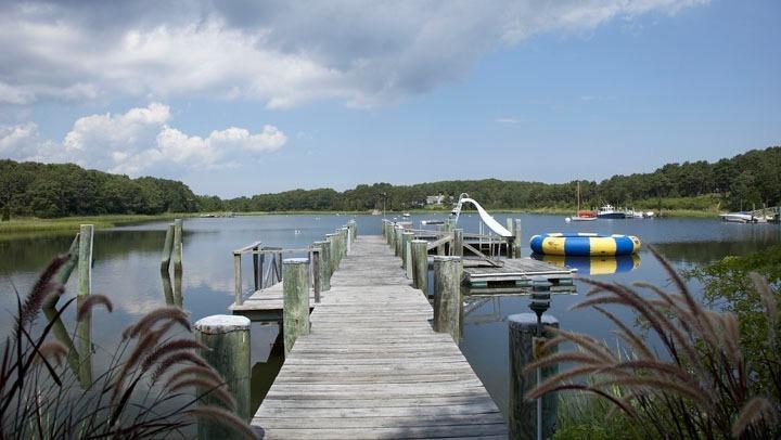 265 Seapuit Road Osterville, MA 02655 - Photo 4 of 30 a view of a lake with a deck
