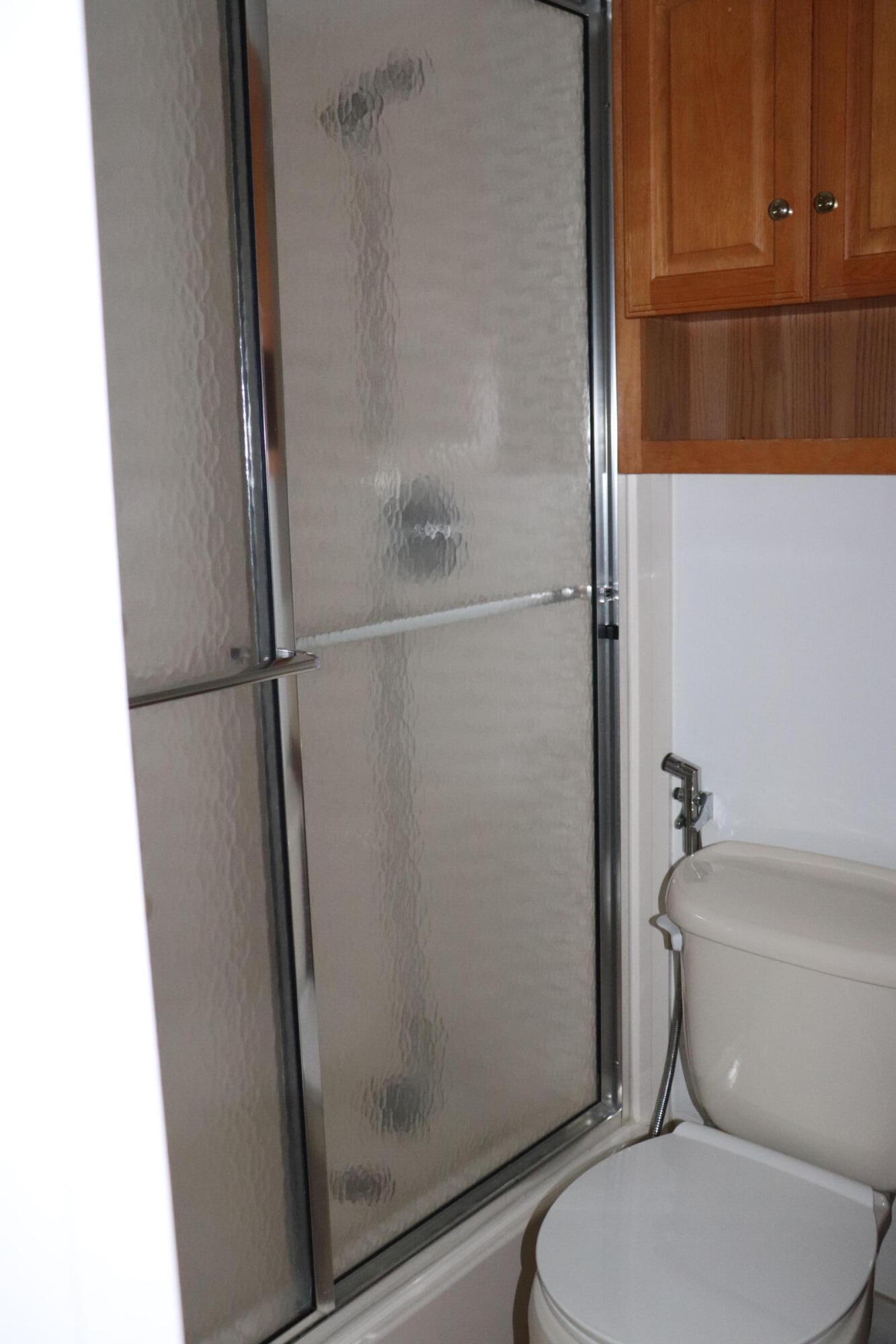 201 Cardinal Lane Delray Beach, FL 33445 - Photo 12 of 20 a white toilet sitting next to a bath tub