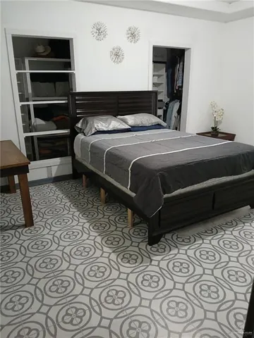 a bedroom with a bed and a cabinets