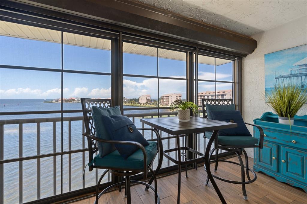8211 Brent Street, Unit 847 Port Richey, FL 34668 - Photo 9 of 29 a view of a dining room with furniture window and wooden floor