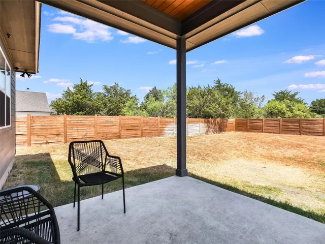 a view of a two chair in the room next to a yard