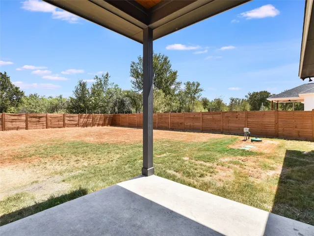 a view of a yard with an outdoor space