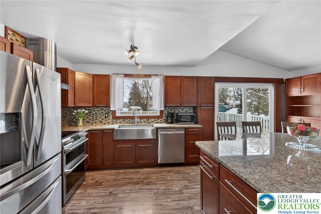 4000 Carter Road Bethlehem, PA 18020 - Photo 19 of 48 a kitchen with stainless steel appliances granite countertop sink stove refrigerator and cabinets