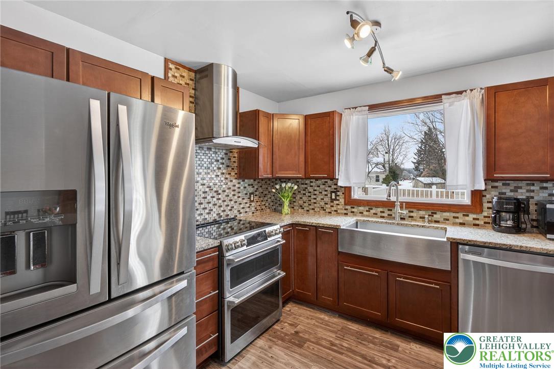 4000 Carter Road Bethlehem, PA 18020 - Photo 20 of 48 a kitchen with stainless steel appliances granite countertop a refrigerator and a sink