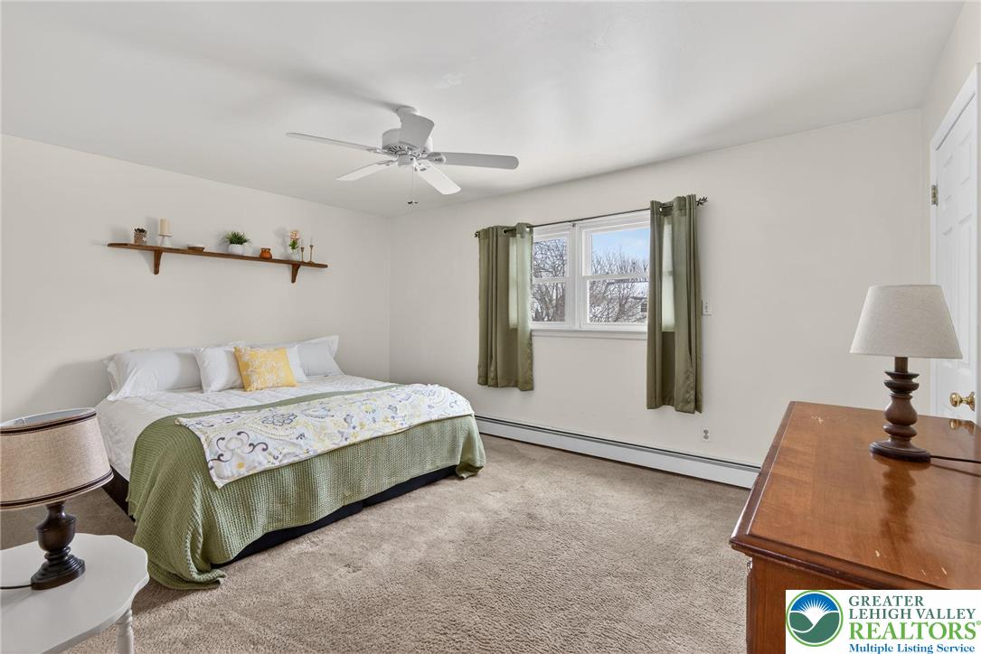 4000 Carter Road Bethlehem, PA 18020 - Photo 22 of 48 a spacious bedroom with a bed and wooden floor