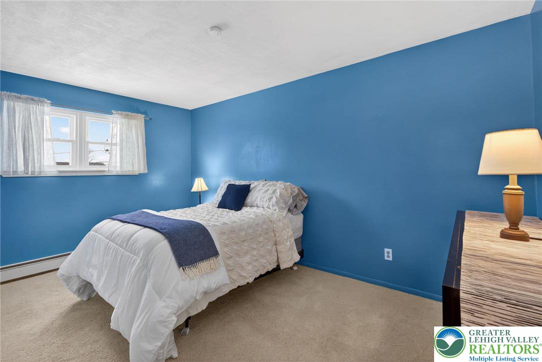 4000 Carter Road Bethlehem, PA 18020 - Photo 24 of 48 a bedroom with a bed and a lamp on table