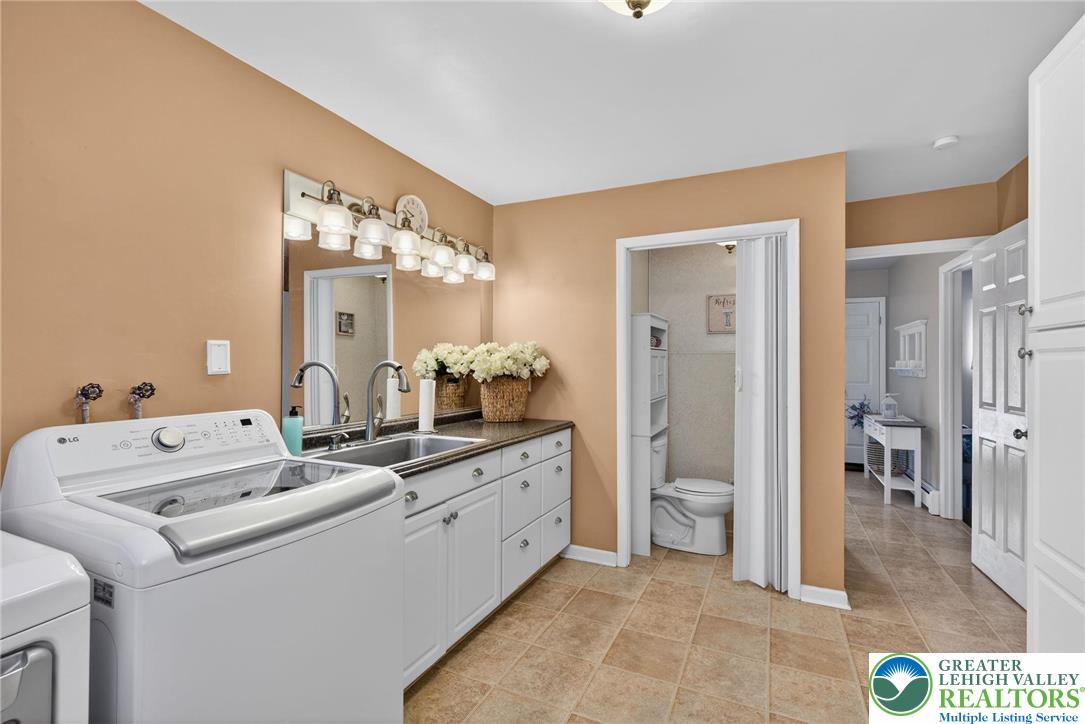 4000 Carter Road Bethlehem, PA 18020 - Photo 33 of 48 a bathroom with a mirror sink and toilet