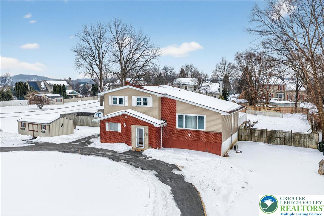 4000 Carter Road Bethlehem, PA 18020 - Photo 39 of 48 a front view of a house with a yard covered with snow