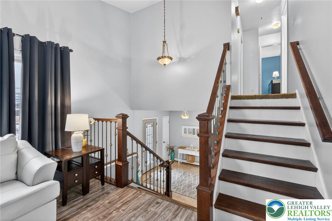 4000 Carter Road Bethlehem, PA 18020 - Photo 9 of 48 a view of staircase with lots of frames on wall and wooden floor