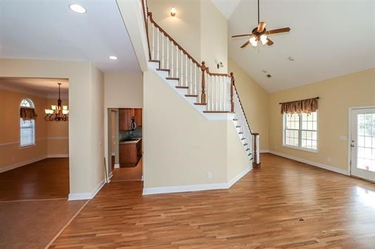 5982 Purple Road Byron, GA 31008 - Photo 11 of 36 a view of a livingroom with wooden floor and stairs