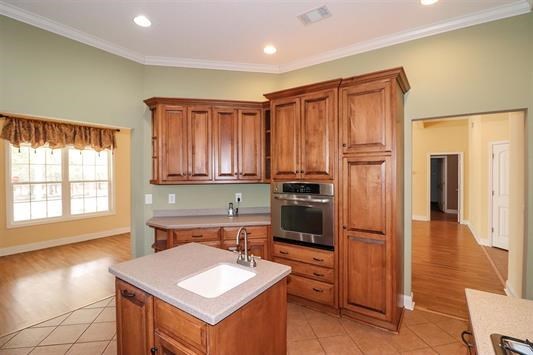 5982 Purple Road Byron, GA 31008 - Photo 17 of 36 a kitchen with a sink cabinets and stainless steel appliances