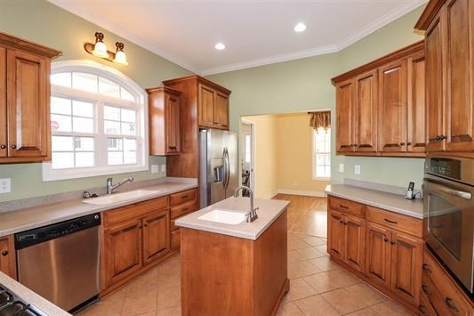 5982 Purple Road Byron, GA 31008 - Photo 18 of 36 a kitchen with stainless steel appliances granite countertop a sink stove and refrigerator