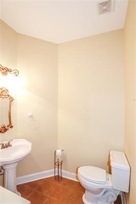 5982 Purple Road Byron, GA 31008 - Photo 19 of 36 a bathroom with a toilet a sink and a mirror