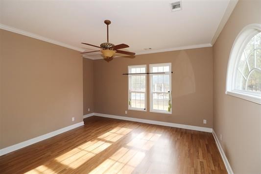 5982 Purple Road Byron, GA 31008 - Photo 20 of 36 a view of an empty room with wooden floor and a window