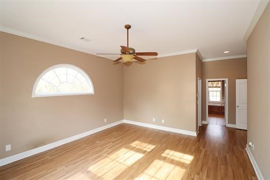 5982 Purple Road Byron, GA 31008 - Photo 21 of 36 a view of a room with wooden floor and a ceiling fan