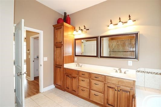 5982 Purple Road Byron, GA 31008 - Photo 24 of 36 a bathroom with double vanity sink and a mirror