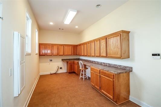 5982 Purple Road Byron, GA 31008 - Photo 30 of 36 a kitchen with stainless steel appliances granite countertop a stove a sink and a refrigerator with wooden floor
