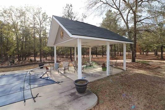 5982 Purple Road Byron, GA 31008 - Photo 34 of 36 a view of a patio with table and chairs and potted plants