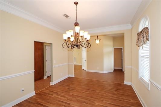 5982 Purple Road Byron, GA 31008 - Photo 6 of 36 a view of a chandelier and wooden floor in a room
