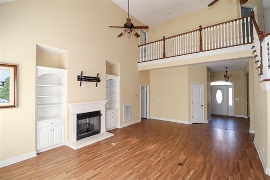 5982 Purple Road Byron, GA 31008 - Photo 10 of 36 a view of empty room with fireplace and wooden floor