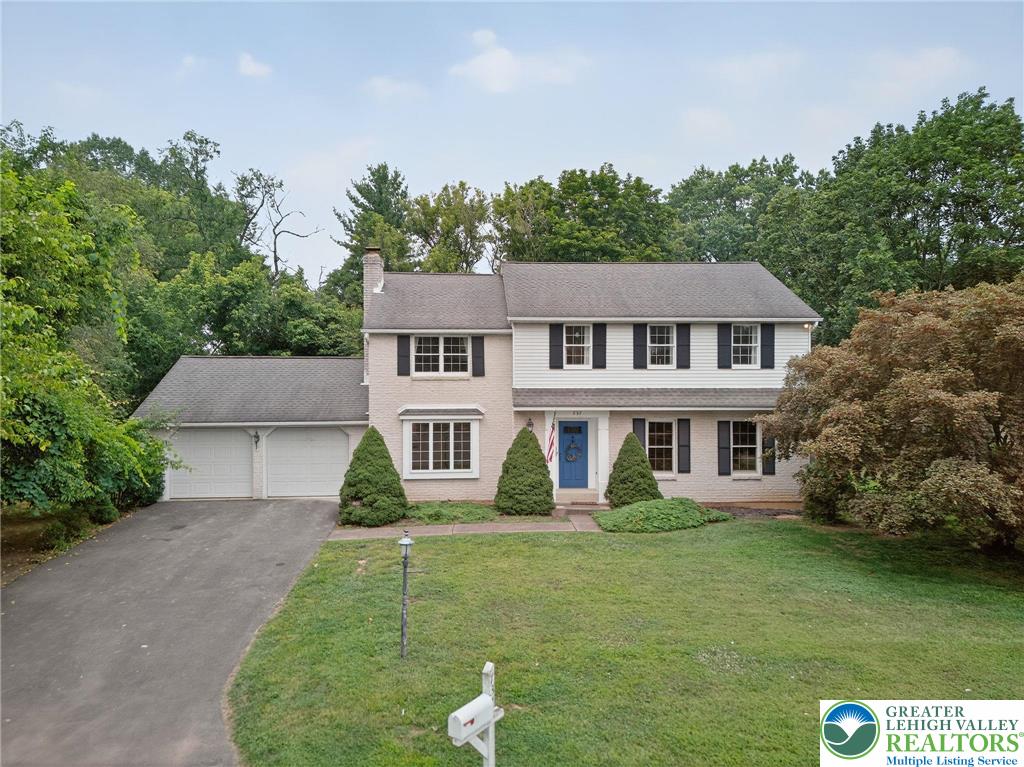 737 Apollo Drive Bethlehem, PA 18017 - Photo 1 of 54 a front view of a house with garden