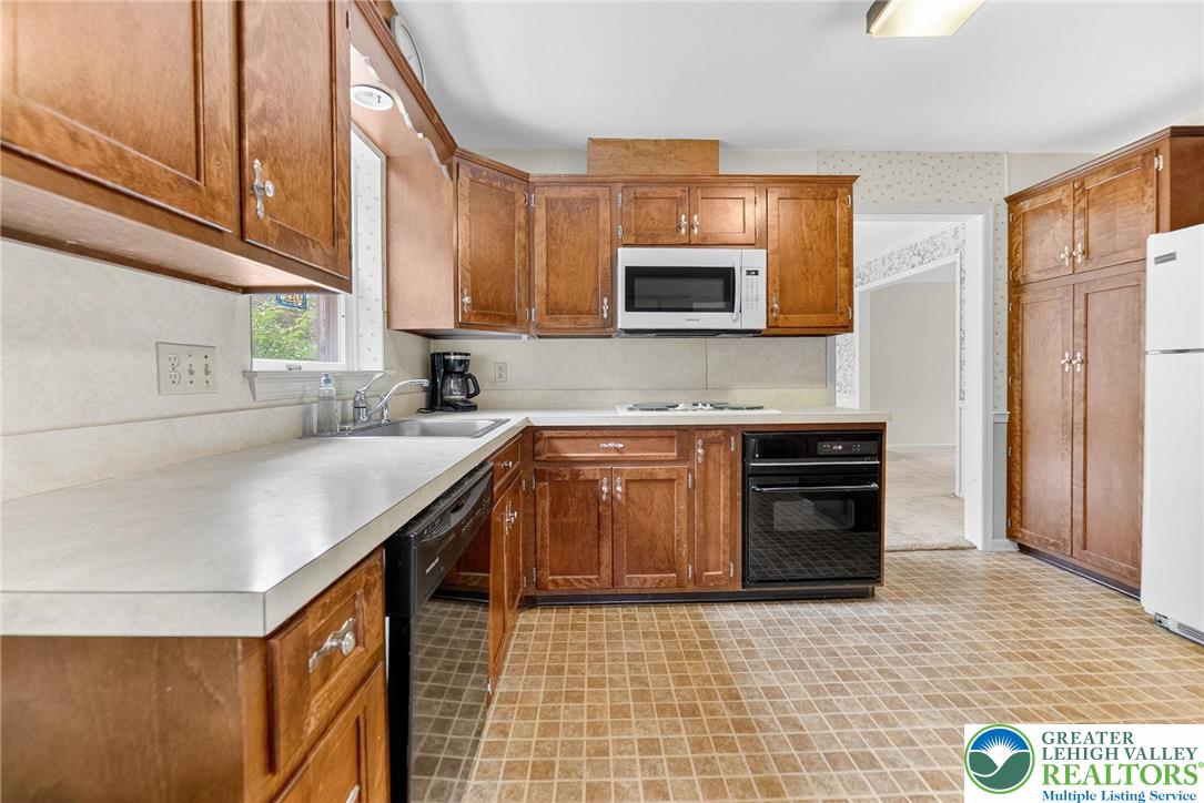737 Apollo Drive Bethlehem, PA 18017 - Photo 49 of 54 a kitchen with stainless steel appliances a sink stove and cabinets