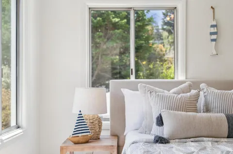 a bedroom with a bed and a couch