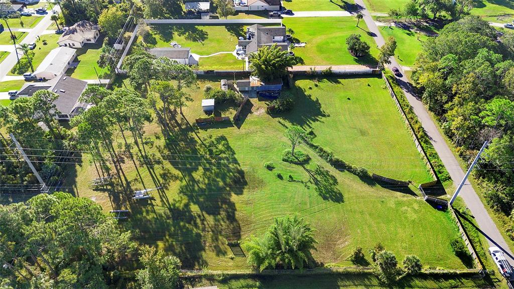 1679 Pinedale Road Edgewater, FL 32132 - Photo 14 of 24 a view of a large yard with lots of green space