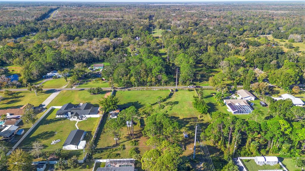 1679 Pinedale Road Edgewater, FL 32132 - Photo 15 of 24 an aerial view of residential houses with yard