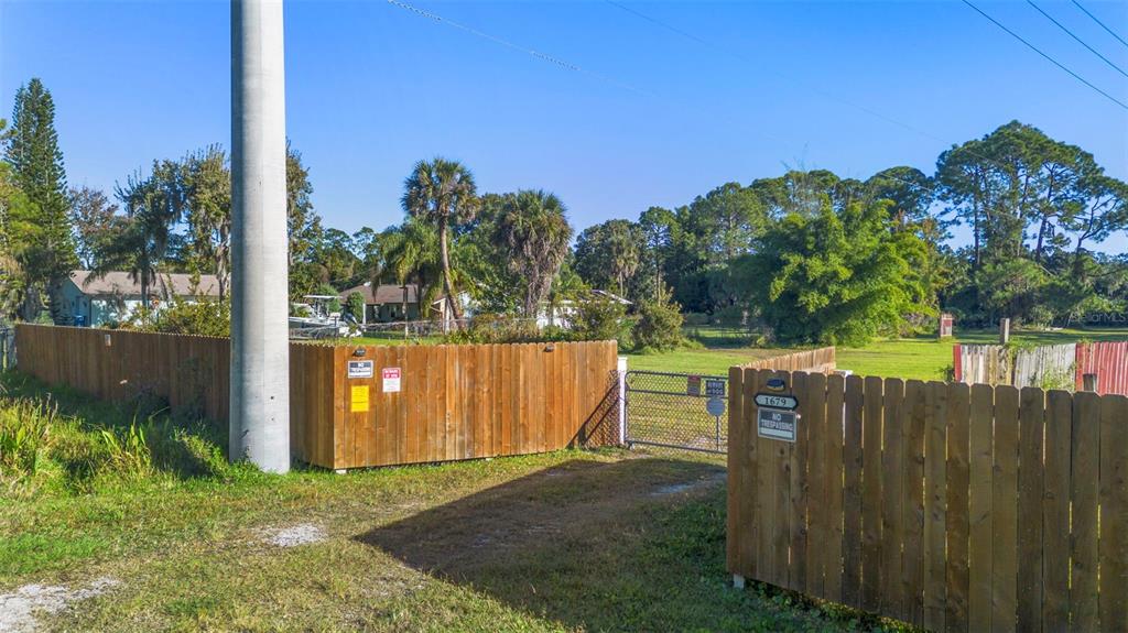 1679 Pinedale Road Edgewater, FL 32132 - Photo 18 of 24 a view of a park with a large trees with wooden fence
