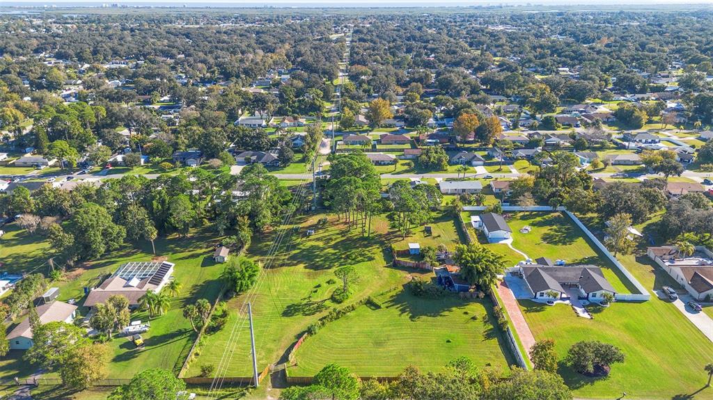 1679 Pinedale Road Edgewater, FL 32132 - Photo 2 of 24 an aerial view of residential houses with outdoor space