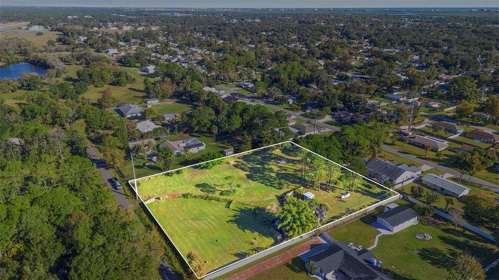 1679 Pinedale Road Edgewater, FL 32132 - Photo 21 of 24 an aerial view of residential houses with outdoor space