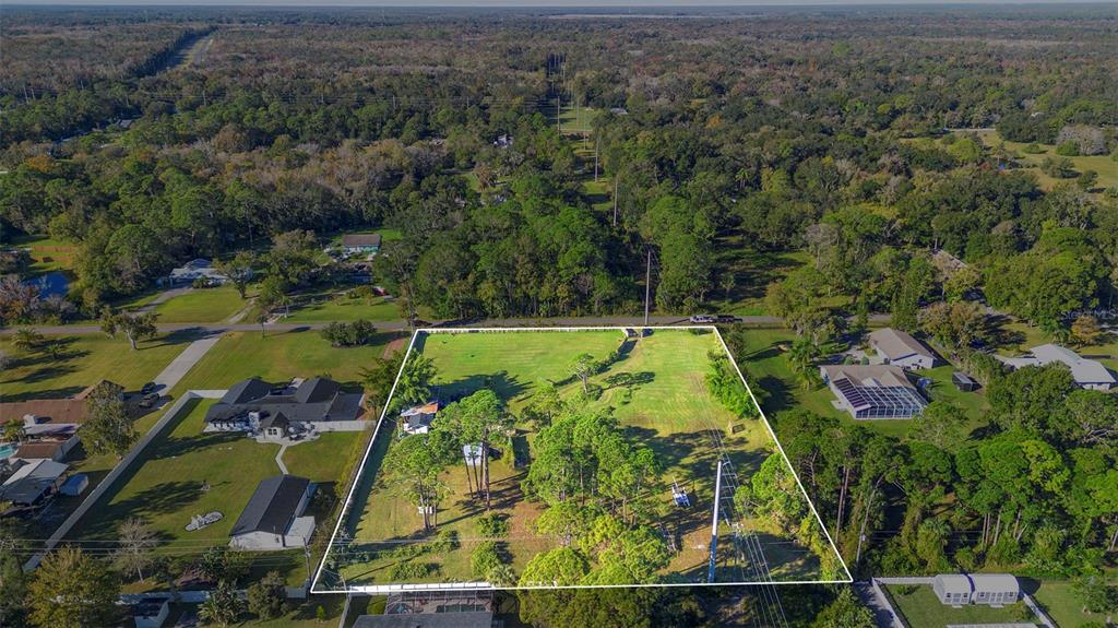 1679 Pinedale Road Edgewater, FL 32132 - Photo 22 of 24 an aerial view of a yard
