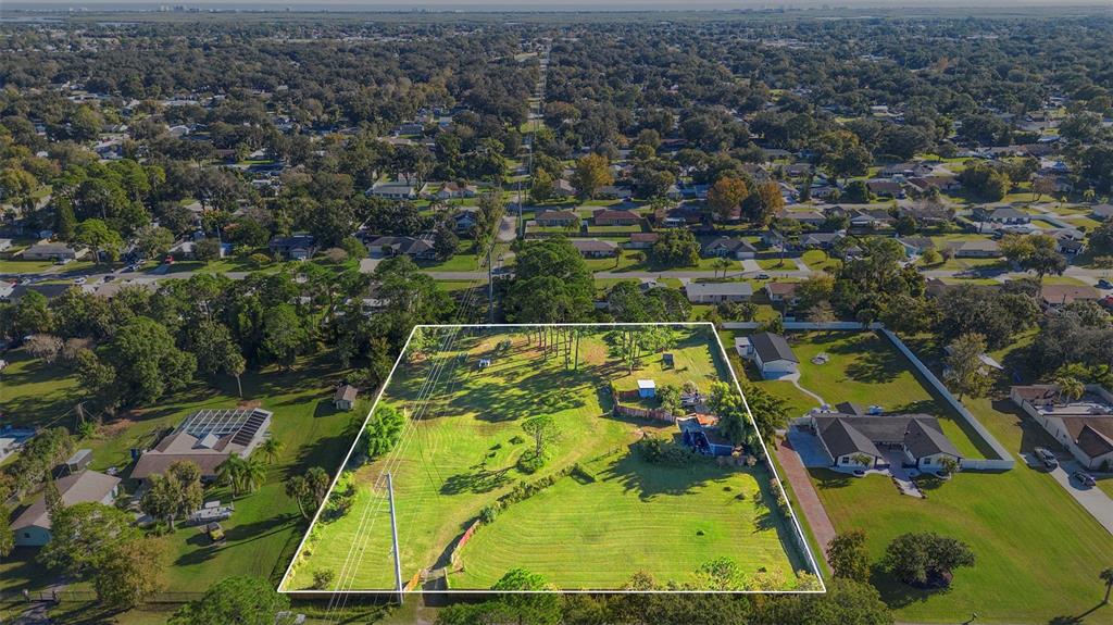 1679 Pinedale Road Edgewater, FL 32132 - Photo 24 of 24 an aerial view of a houses with swimming pool