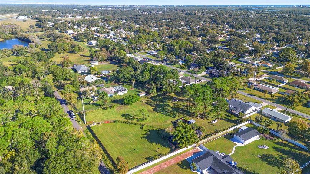1679 Pinedale Road Edgewater, FL 32132 - Photo 7 of 24 an aerial view of residential houses with outdoor space