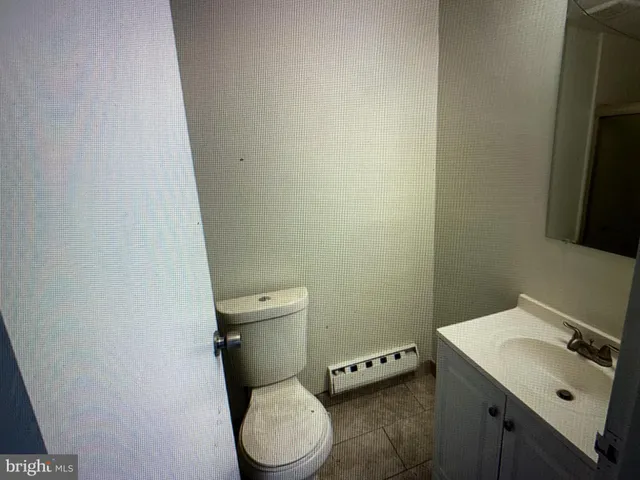 a bathroom with a sink and toilet
