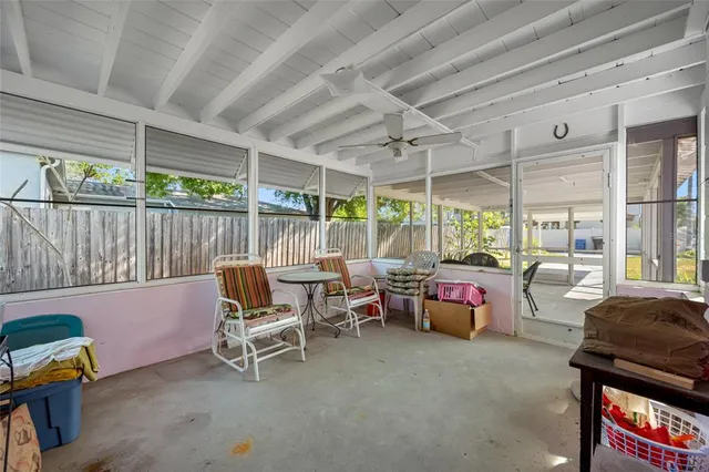 a patio with patio couch and chairs