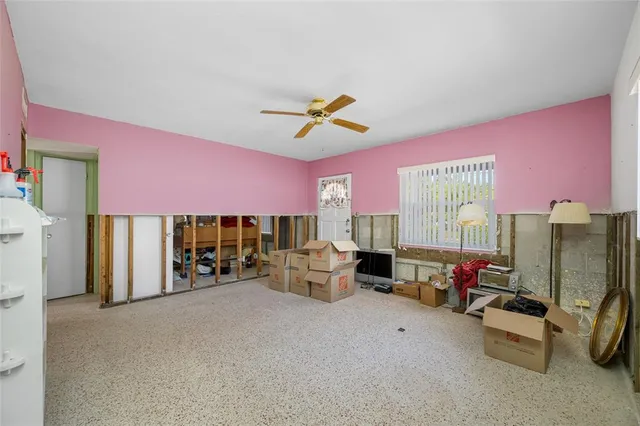 a bed room with furniture and a flat screen tv