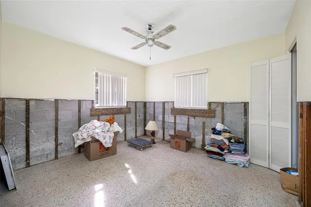 a bed room with furniture and a chandelier