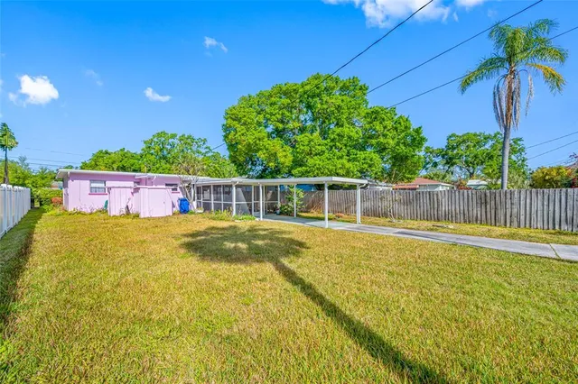 a view of a swimming pool with a yard