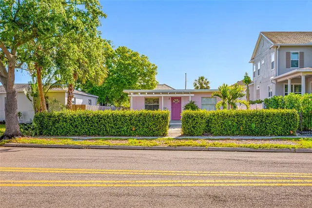 a view of house with a swimming pool