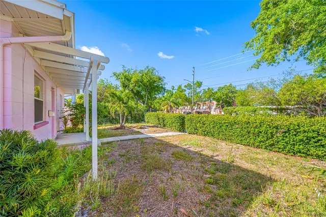 a view of a pathway both side of a house