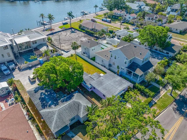 an aerial view of a house with a garden and swimming pool