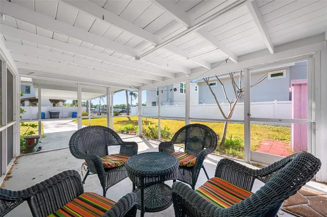 a view of swimming pool with outdoor seating
