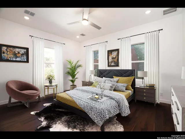 a bedroom with a bed and a chair